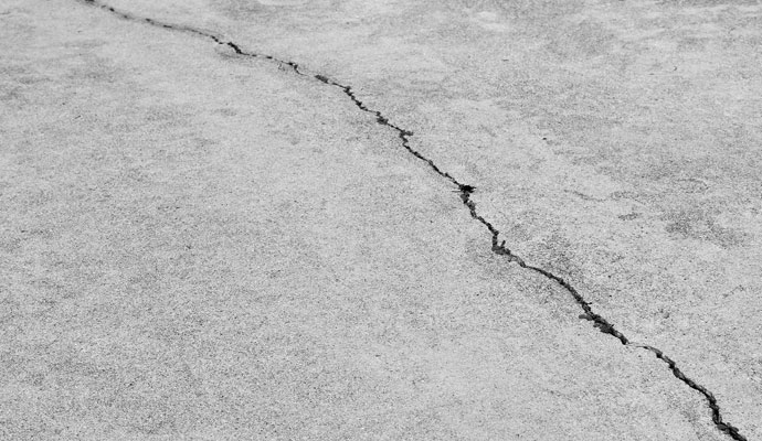 Close-up view of basement floor crack.