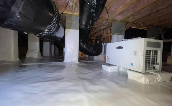  A installed dehumidifier in a basement.