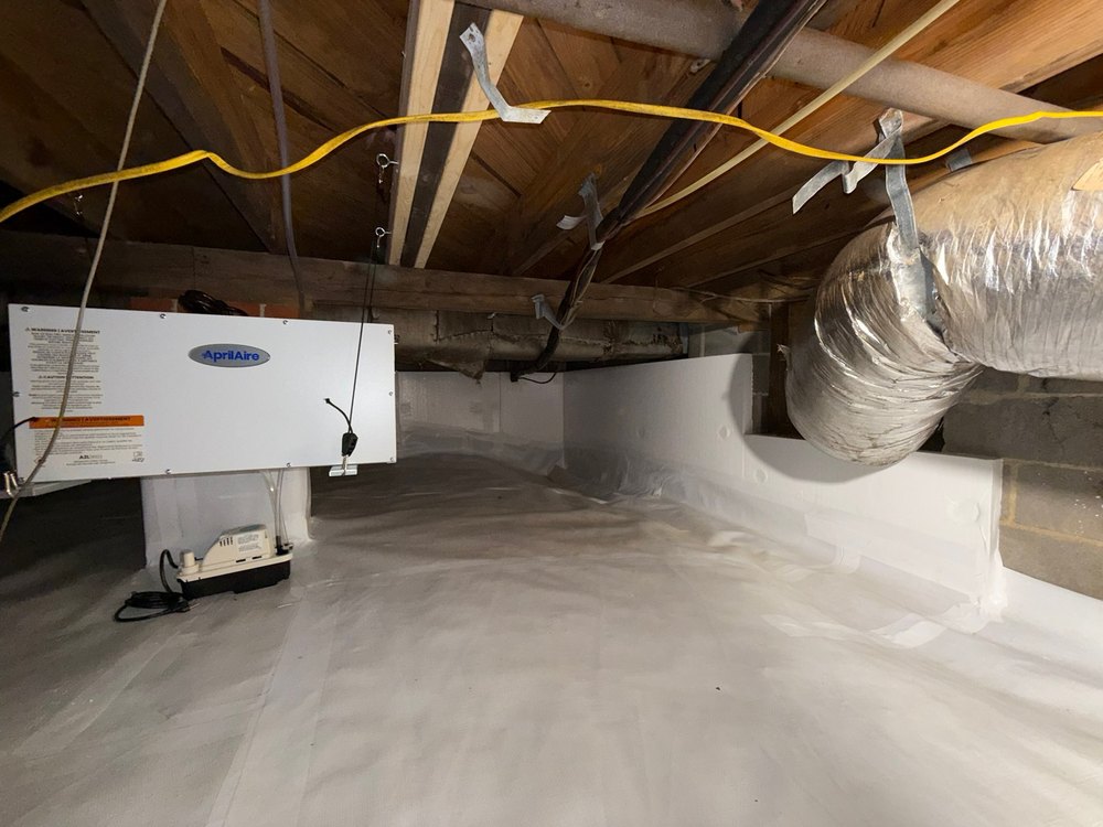 Dehumidifier and insulated ducts in a sealed crawl space
