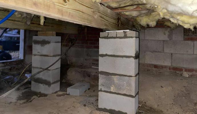 A crawl space with concrete block supports