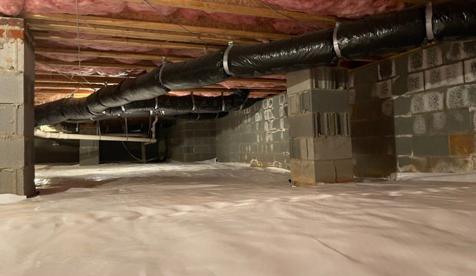 a crawl space with vapor barrier installed