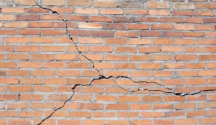 A cracked brick wall