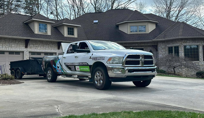 Dryworx service pick-up truck with trailer.